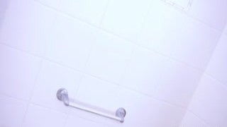 Slim and hot wanker Nina boosts her clitoris in the shower